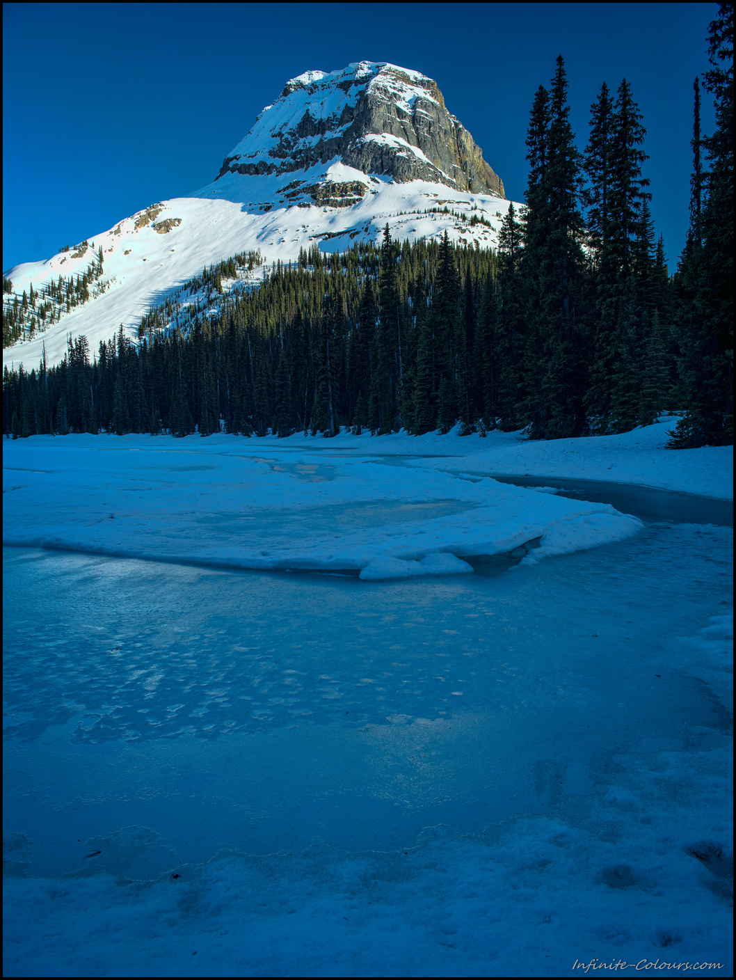 Last light at frozen Yoho Lake Winter Camping