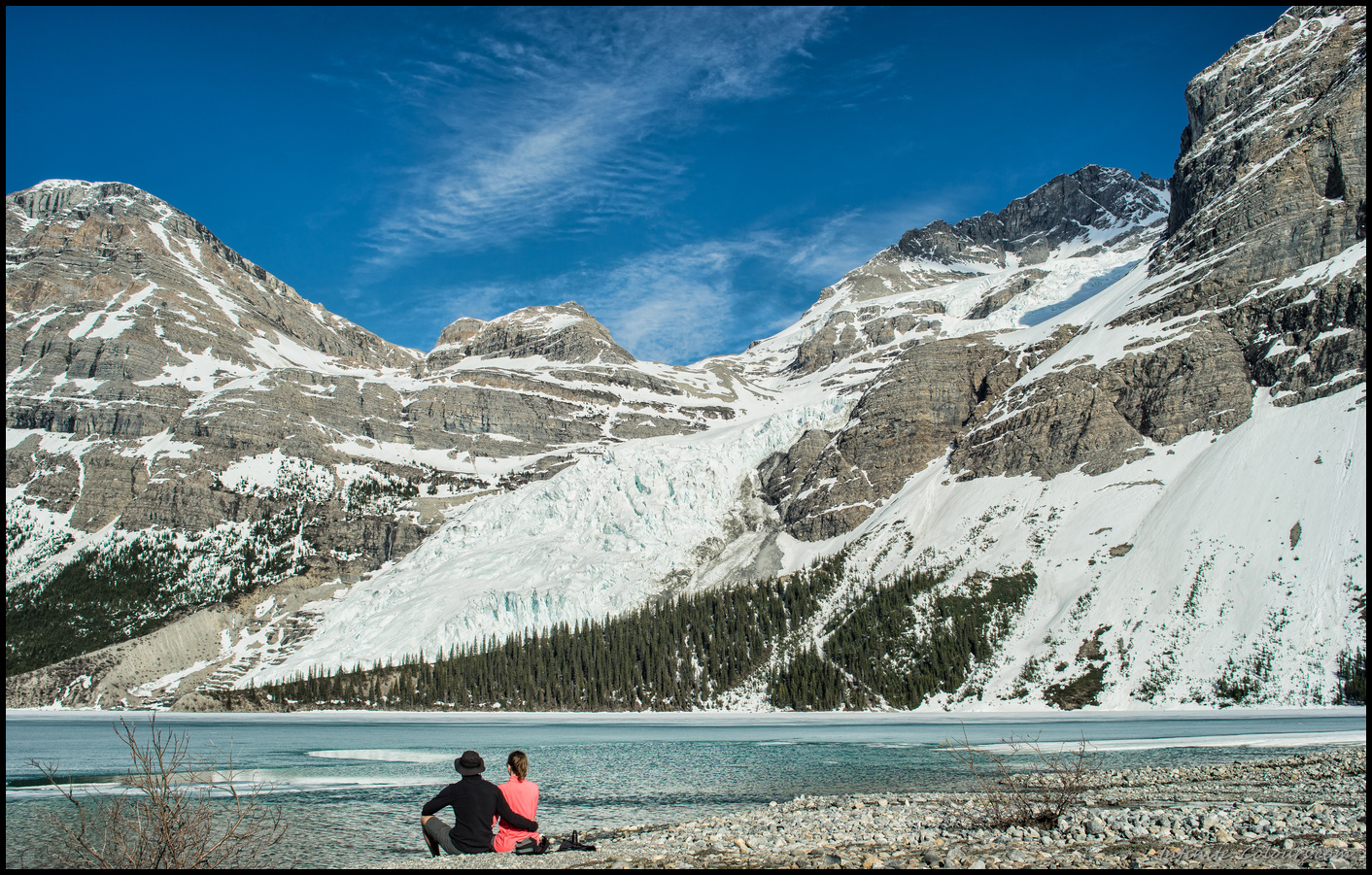 Catching the afternoon sun at Berg Lake pebble beach at Marmot campsite